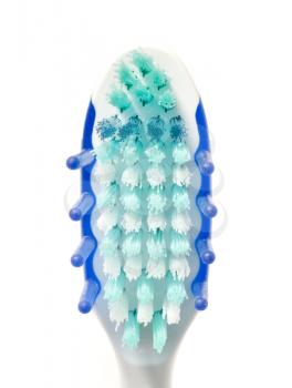 Extreme closeup of toothbrush on white