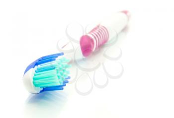 Healthy lifestyle - modern toothbrush on white (focus on bristle)