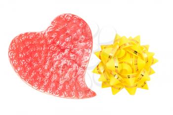 Love greetings - red heart and yellow bow isolated