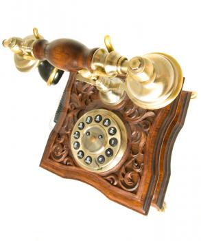 Conversation. Top side view of antique telephone with focus on receiver (wide-angle shot)
