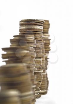 Towers assembled of coins. Slump or growth. Shallow DOF with focus in the center