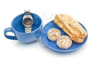 Waiting for Lunch time - Watch, empty blue cup and delicious pastry
