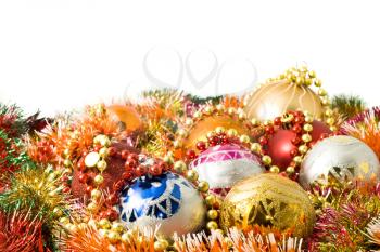 Beautiful Christmas decoration balls and colorful tinsel over white