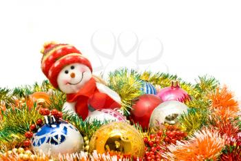 Christmas comes - Funny snowman and decoration baubles over white
