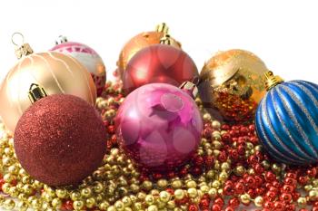 Christmas decoration - group of balls and colorful beads and over white