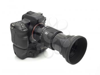 Professional DSLR camera with telephoto lens isolated over white
