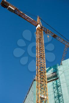 Construction site: crane and unfinished buiding. Large resolution