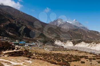 Himalayas in Nepal: highland village and peaks. Large resolution