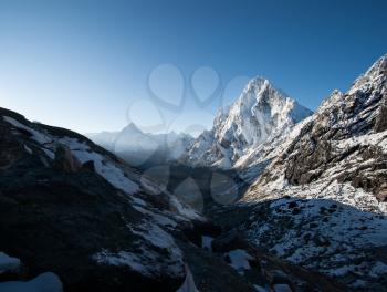 Cho La pass and snowed peaks at dawn in Himalayas. Climbing in Nepal
