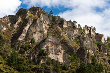 Himalaya Landscape: rocks, trees and Buddhist symbols. Travel to Nepal