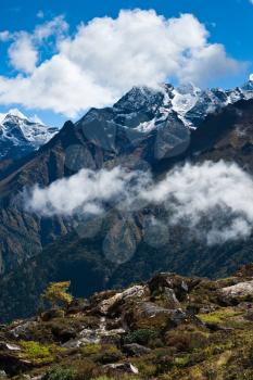 Himalayas in autumn: peaks and clouds. Hiking in Nepal