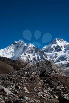 Snowbound mountain peaks and blue sky in Himalayas. Travel to Nepal
