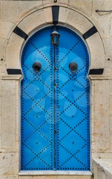 Blue Traditional door with arch from Sidi Bou Said in Tunisia