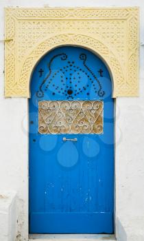 Blue door with ornament and arch from Sidi Bou Said in Tunisia. Large resolution