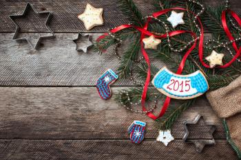 Christmas and New Year 2015 decorated cookies in rustic style on wood. Free space for text