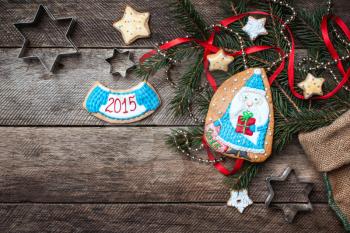 Cute Santa and New Year star cookies in rustic style on wood. Free space for text