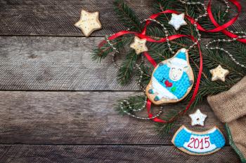 Xmas and New Year 2015 sheep cookie and pastry on wood in rustic style. Free space for text
