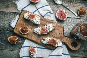rustic style healthy snacks with cut figs on napkin. Breakfast, lunch food photo