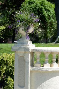 Royalty Free Photo of a Pillar With a Potted Plant