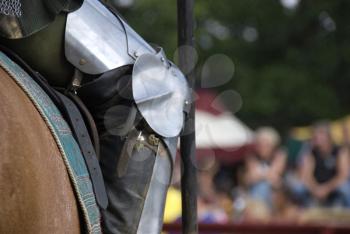 Royalty Free Photo of the Leg of a Suit of Armour on a Horse