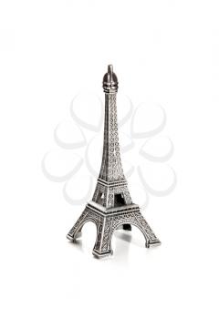 small copy of eiffel tower on white background