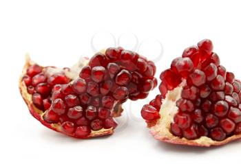 part of tasty pomegranate fruit on white background