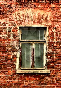 window and brick wall of old house