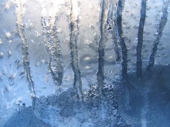 water drops and frost on winter windowpane