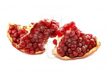 close up of tasty pomegranate fruit on white background