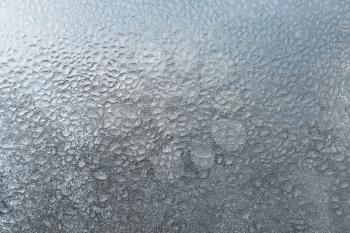 texture of frozen water drops on glass