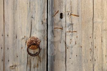 Old wooden door with round handle