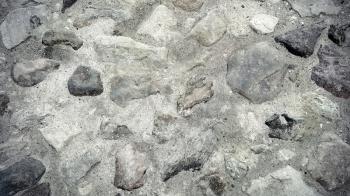 Close up of road surface paved with rough stones