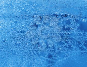 Natural texture of ice pattern on winter glass