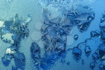 Natural ice pattern on winter window glass
