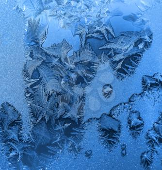 Natural ice pattern on winter window glass