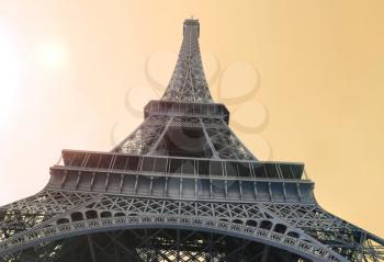 Bottom view on Eiffel Tower in sunlight, Paris, France
