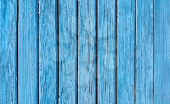 Texture of old wooden blue fence close-up