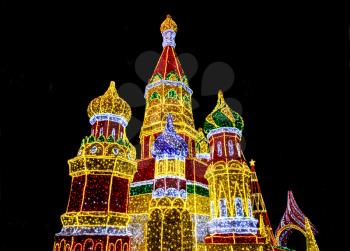 Bright lights decoration in form of Saint Basil's Cathedral (Sobor Vasiliya Blazhennogo, Cathedral of Vasily the Blessed) in evening Moscow, Russia