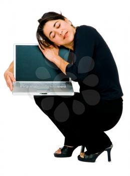 Royalty Free Photo of a Woman Squatting and Hugging her Laptop
