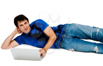 Royalty Free Photo of a Man Laying on the Floor Using a Laptop