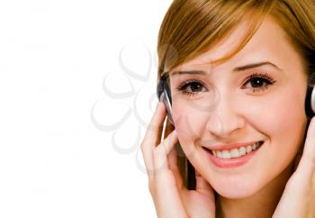 Royalty Free Photo of a Fashion Model Listening to Headphones