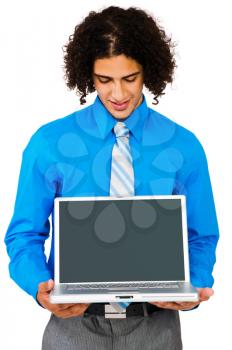 Royalty Free Photo of a Businessman Presenting a Laptop