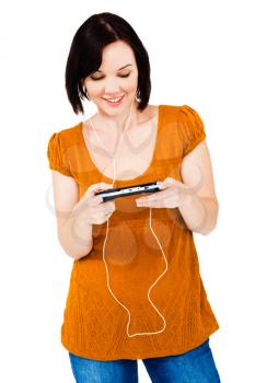 Royalty Free Photo of a Woman Listening to Music on Earbuds