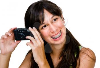 Royalty Free Photo of a Teenage Girl Wearing Braces Holding a Camera