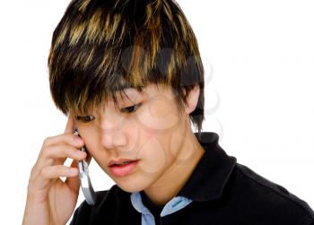 Royalty Free Photo of a Teenage Boy Talking on a Mobile Phone