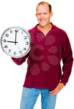 Royalty Free Photo of a Man Smiling and Holding a Clock Set at 9 o clock
