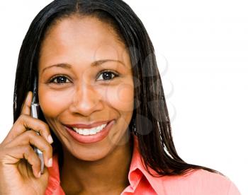 Royalty Free Photo of a Woman Smiling and Talking on her Mobile Phone