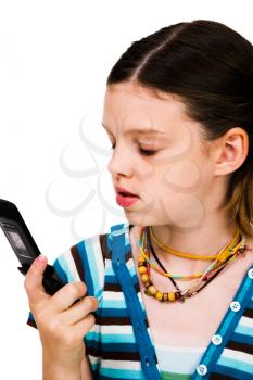 Royalty Free Photo of a Young Girl Text Messaging on her Mobile Phone