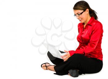 Royalty Free Photo of a Woman Sitting Down Using a Laptop