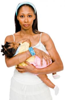 Woman carrying her daughter and smiling isolated over white